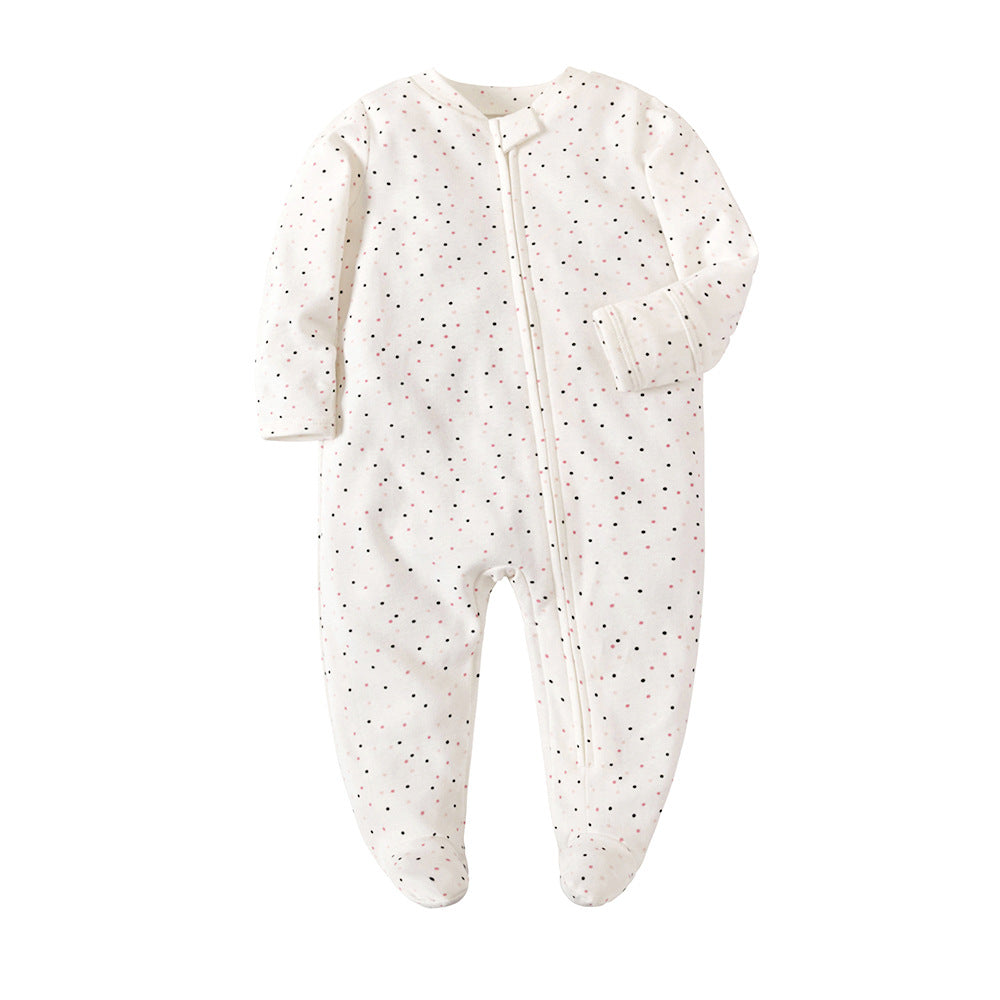 Cream Spots print baby romper with a zip from one ankle to the neck, covered feet and fold-over cuffs, laid flat