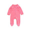 Coral pink flower zip baby sleepsuit with covered feet and a snap tab at the neck, laid flat