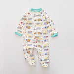 Cream digger zip baby sleepsuit with covered feet and a snap tab at the neck, laid flat