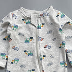 Close-up of the grey construction print, the cotton jersey and the top of the zip