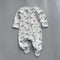Grey construction zip baby sleepsuit with covered feet and fold-over hand cuffs, laid flat