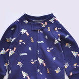 Close-up of the navy rocket print, the cotton jersey and the top of the zip