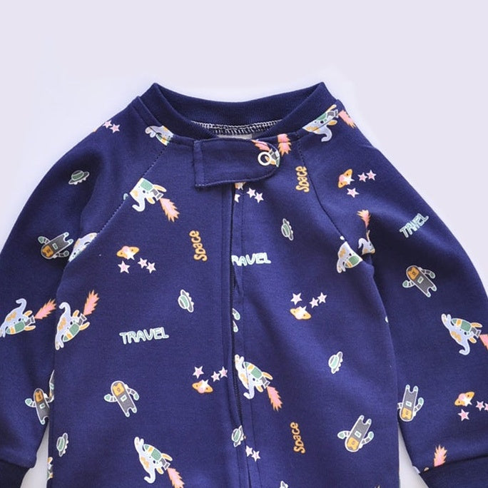 Close-up of the navy rocket print, the cotton jersey and the top of the zip
