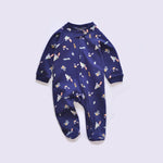 Navy rocket zip baby sleepsuit with covered feet and a snap tab at the neck, laid flat