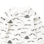 Close-up of the white moustache print, the cotton jersey and the top of the zip