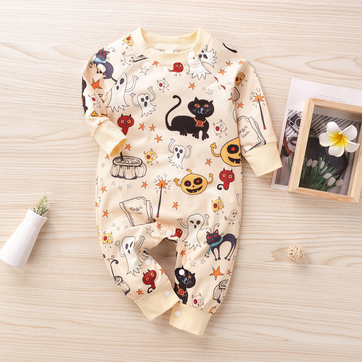Spooky and Adorable: Dress Your Little One in Our Halloween Print Baby Jumpsuit