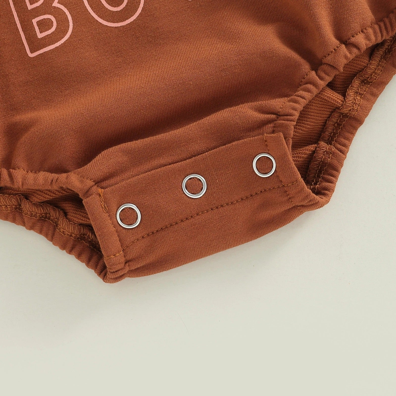 Add Style and Comfort to Your Child's Wardrobe with Our Brown Lettering Printed Romper